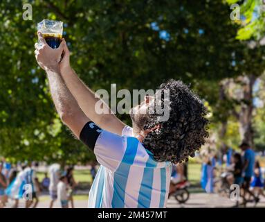 La Plata, Buenos Aires, Argentina - December 18, 2022: A fan with a wig replicates to Diego Armando Maradona when he lifted the trophy during 1986 Wor Stock Photo