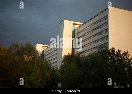 Large building in city. View of house with lots of windows. Details of architecture in metropolis. Stock Photo