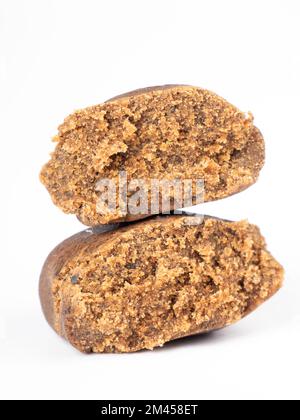 isolated cannabis hash piece, brown hashish on white background. Stock Photo