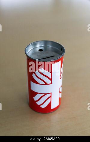 Freiburg, Germany. 15th Dec, 2022. ILLUSTRATION - A can for collecting donations stands on a table. Many people donated to help people in war-torn Ukraine. (to dpa 'Caritas: Ukraine war triggers large wave of donations ') Credit: Philipp von Ditfurth/dpa/Alamy Live News Stock Photo