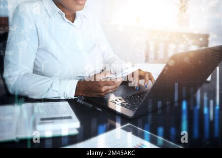 Finance graphs, stock market and black woman with phone, working online and typing on laptop with documents. Accounting, stock trading and smartphone Stock Photo