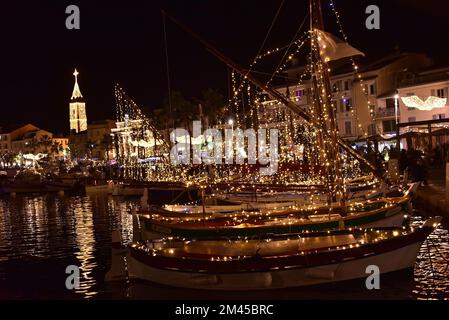 Traditional fishing boats illuminated Christmas celebrations in Sanary Stock Photo