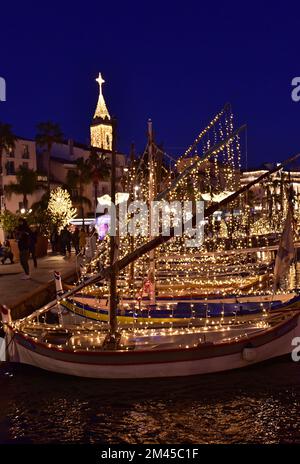 Traditional fishing boats illuminated Christmas celebrations in Sanary Stock Photo