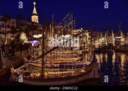 Traditional fishing boats illuminated Christmas celebrations in Sanary Stock Photo