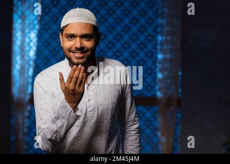 Portrait of a Muslim man greeting with adab Stock Photo