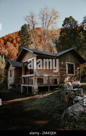 Porch of a wooden house in the forest on the river bank Stock Photo - Alamy