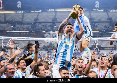 Argentina's Lionel Messi celebrate with the trophy their victory over