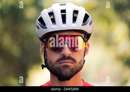cyclist looking at camera with a defiant attitude Stock Photo