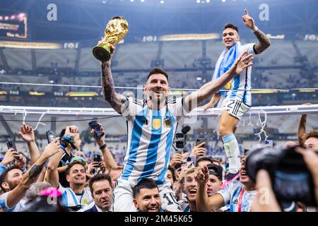 Argentina's Lionel Messi celebrate with the trophy their victory over
