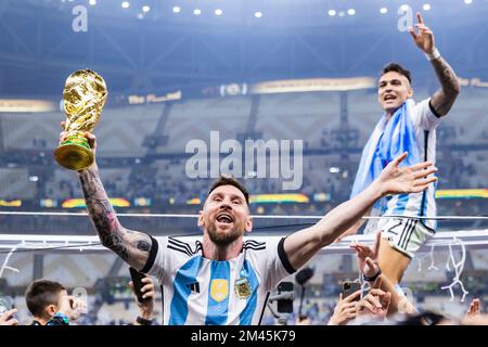 Argentina's Lionel Messi celebrate with the trophy their victory over