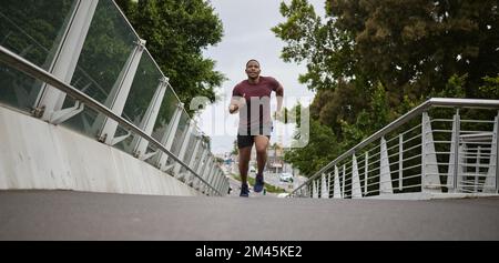 Health, black man and running for fitness, workout and training for marathon, wellness or endurance. African American male, athlete or runner outdoor Stock Photo