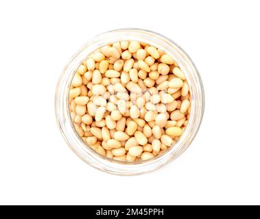 Prepared cedar pine nuts in round glass can isolated on white, top view Stock Photo