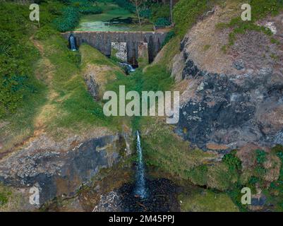 The Cascade V is the small waterfall Close to Souillac town and Gris Gris beach in south Mauritius. The waterfall there is on beach side. Amazing blac Stock Photo