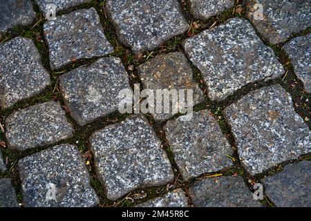 Texture of a stone wall. Old sidewalk stone wall texture background. Stone wall as a background or texture. For background or text. Stock Photo