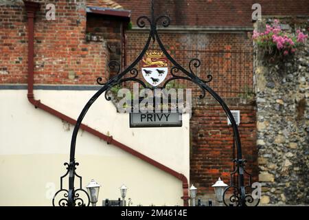 Wrought iron entrance to public toilets with city coat of arms with choughs called a privy, Lower Bridge Street, Canterbury, Kent, England, United Kin Stock Photo