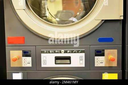 Close up Industrial washing machine control panel, button interface, Laundry industry, cleaning Stock Photo