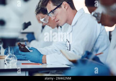 Science, education and students in laboratory with medicine for chemistry, biotechnology and biology lesson. University, healthcare and group of Stock Photo