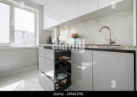 Small White modern domestic kitchen interior with furniture Stock Photo
