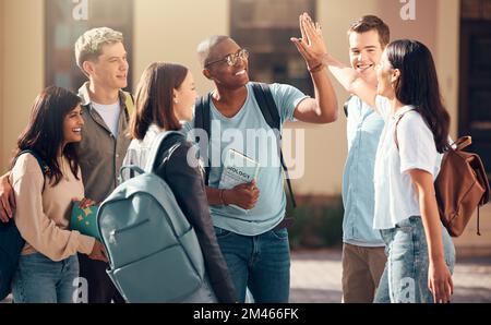 University, friends and student high five of diversity, college and education group outdoor. Students, study and success support hand gesture of Stock Photo