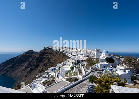 An aerial view of Santorini island surrounded by buildings Stock Photo