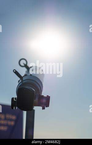 Steel telescope installed on a lookout point. Solar eclipse observation. Stock Photo