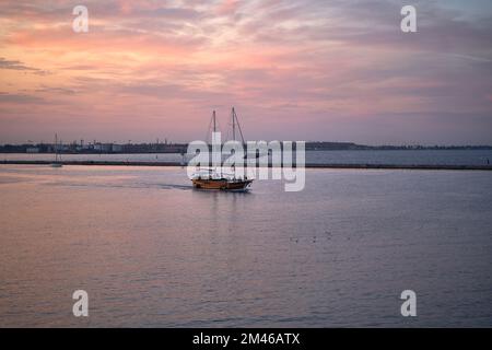 wooden yacht in port. Passenger sailing yacht with a wooden hull leaving the yacht club Stock Photo