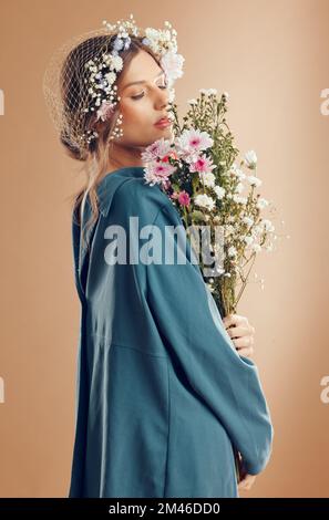 Floral crown, fashion and woman with flowers in studio isolated on