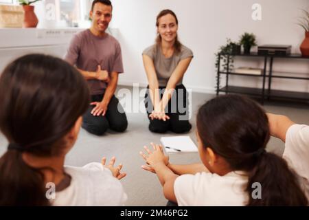 Teachers and children in first aid class Stock Photo