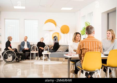 Students resting in cafeteria Stock Photo