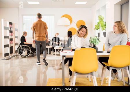 Students resting in cafeteria Stock Photo