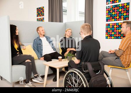 Students resting in cafeteria Stock Photo