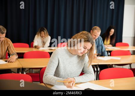 Students in lecture hall Stock Photo