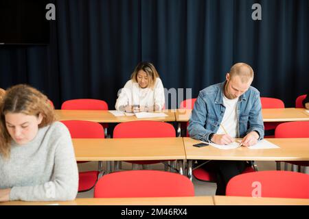 Students in lecture hall Stock Photo