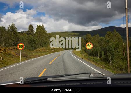 Speed limit signs on road Stock Photo