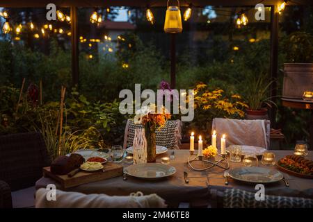 Table set in greenhouse Stock Photo