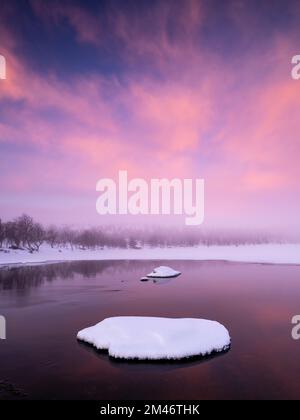 Sunset over winter lake Stock Photo