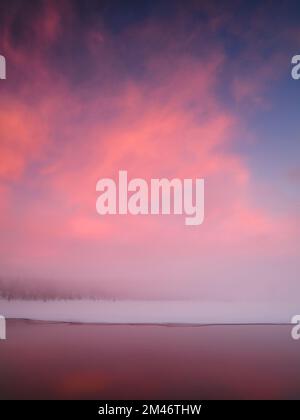 Sunset over winter lake Stock Photo