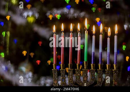 Colorful candles from a burning hanukkah candles in a menorah Selective soft focus Stock Photo