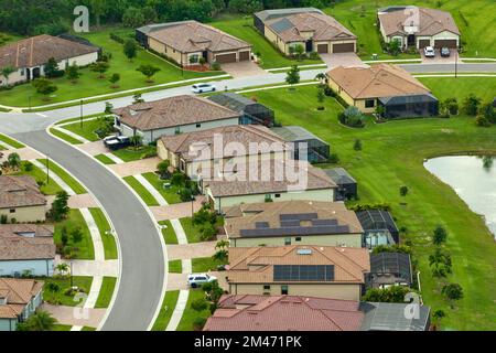 Aerial view of tightly located family houses in Florida closed suburban area. Real estate development in american suburbs Stock Photo