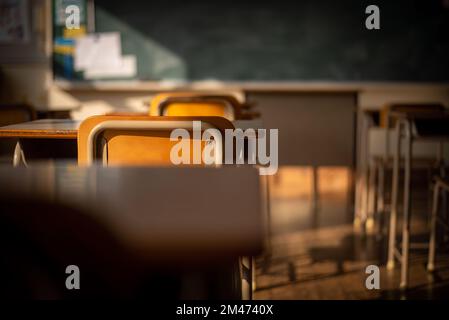 school chairs and desks in an empty Japanese school classroom Stock Photo