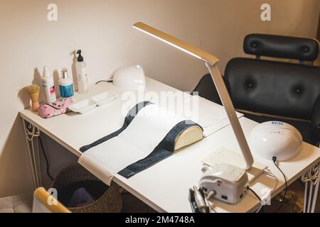 Manicure station set-up. Professional beauty salon interior and equipment. No people. Copy space. High quality photo Stock Photo