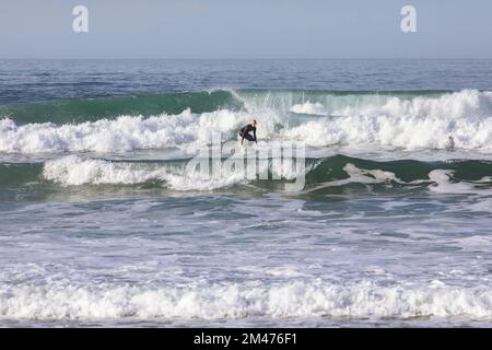 Europe, Portugal, Centro Region, Ferrel, Praia da Almagreira, Surfer riding a Wave on the Atlantic Ocean Stock Photo