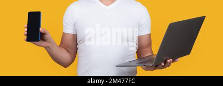 cropped guy showing smartphone screen isolated on yellow background. guy showing smartphone Stock Photo