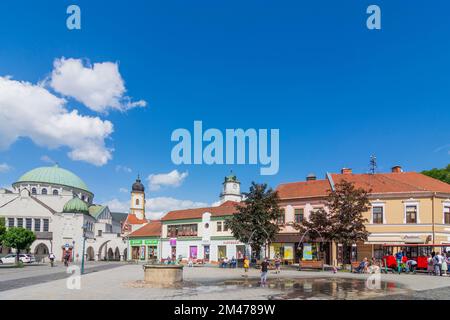 Trencin (Trentschin): Synagogue, Church and monastery of Piarists,, Dolná brána (Lower Gate), square Sturovo namestie in , , Slovakia Stock Photo