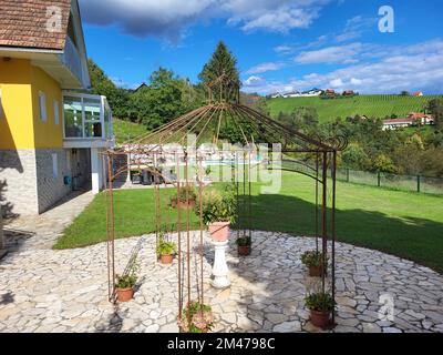 Kitzeck im Sausal, Austria - September 21, 2022: Guesthouse in the mountain village in Southern Styria with garden and pool situated inmidst vineyards Stock Photo