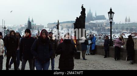 Tourists are walking at Charles Bridge in Prague, Czech Republic, December 18, 2022. (CTK Photo/Milos Ruml) Stock Photo