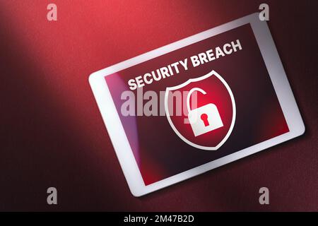 Digital tablet on red background with security breach warning on screen. interface of security breach. Cyber security data protection business. Stock Photo