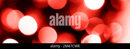 Blurred lights red background, banner texture. Abstract bokeh with soft light header. Wide screen wallpaper. Panoramic web banner with copy space for Stock Photo