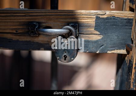 Detail of an old metal padlock with a lock, old jail of the wild west sheriff's office Stock Photo
