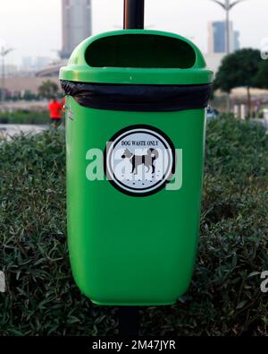 pet waste management system in public place, plastic bin for commercial pet waste disposal Stock Photo